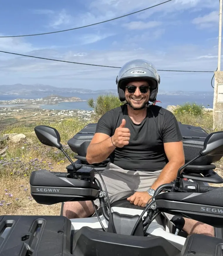 Aerial view of Naxos coastline with quad trails